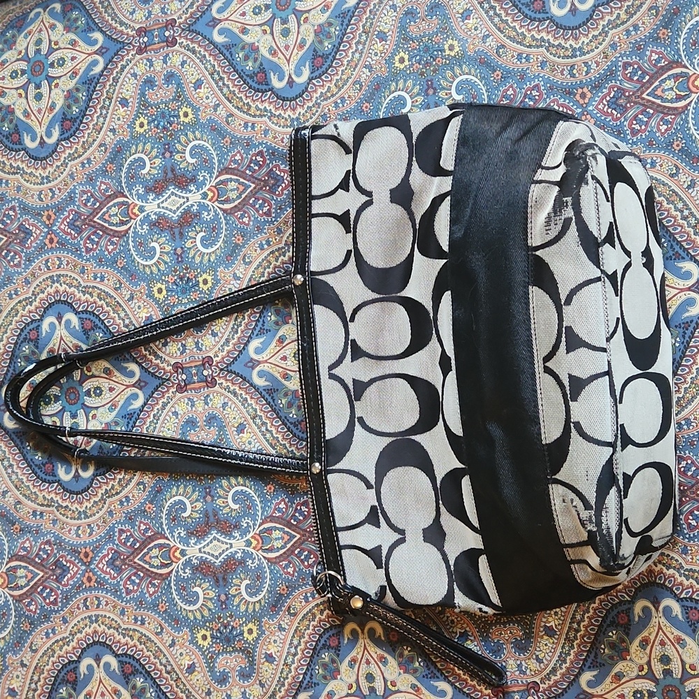 Gray and black Coach purse
